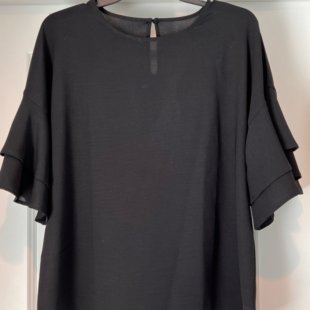Amazon shirt with ruffle bell sleeves.